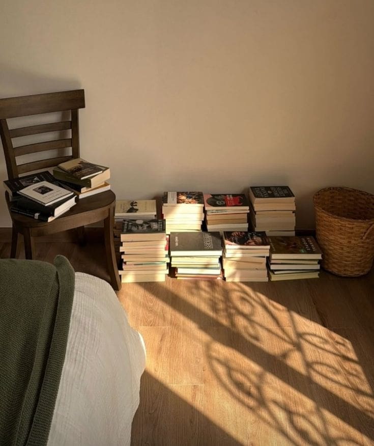 Stack of books on the floor in natural light