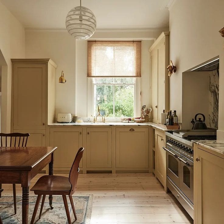 Yellow kitchen by Pernille Lind Farrow and Ball Cord with bamboo window shade 