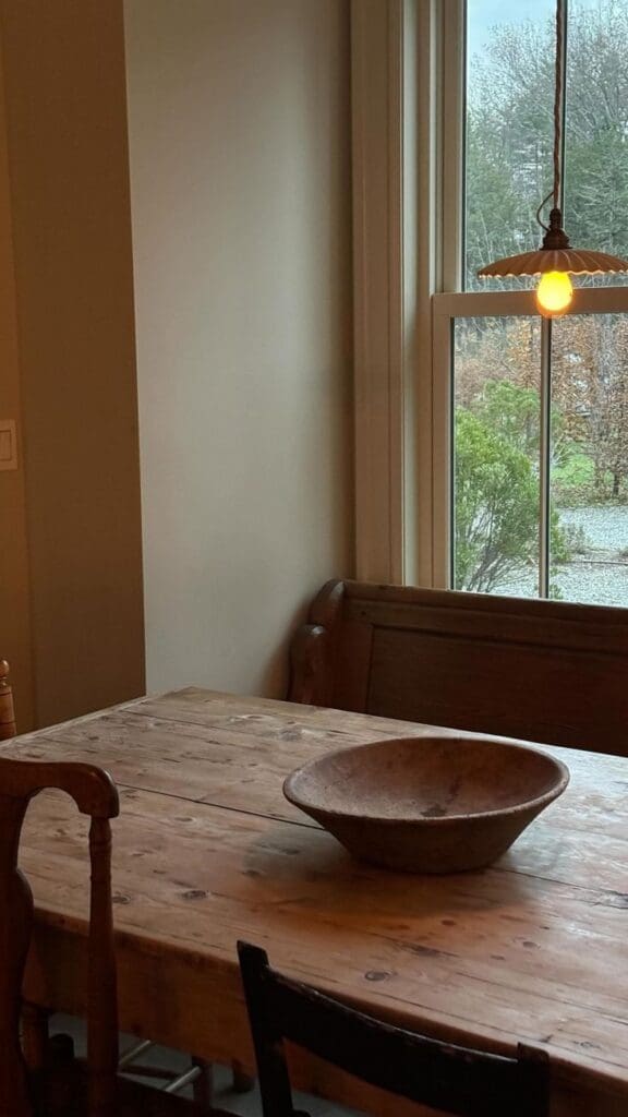 rustic dining room with antique oak dining table, wabi sabi pottery